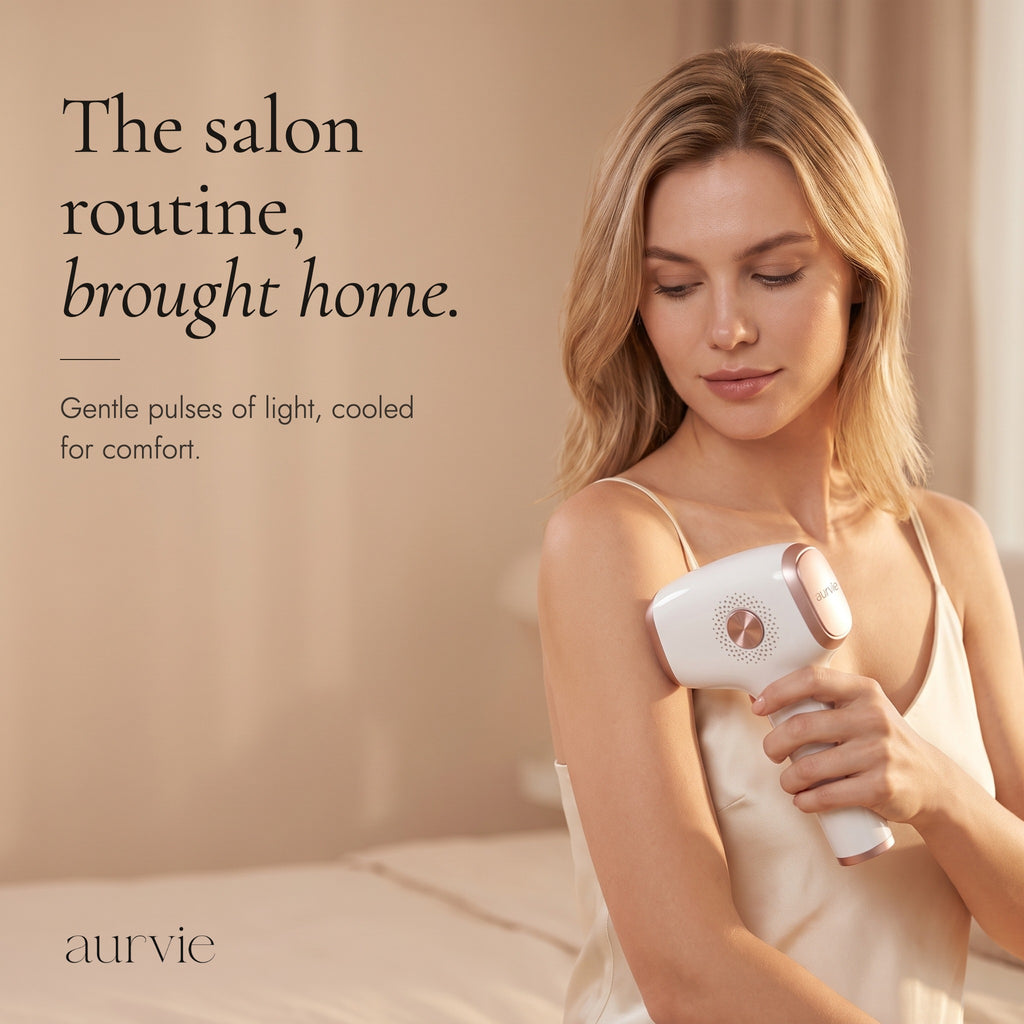 Woman holding the Aurvie IPL device against her upper arm, headline The salon routine, brought home. (ALT)