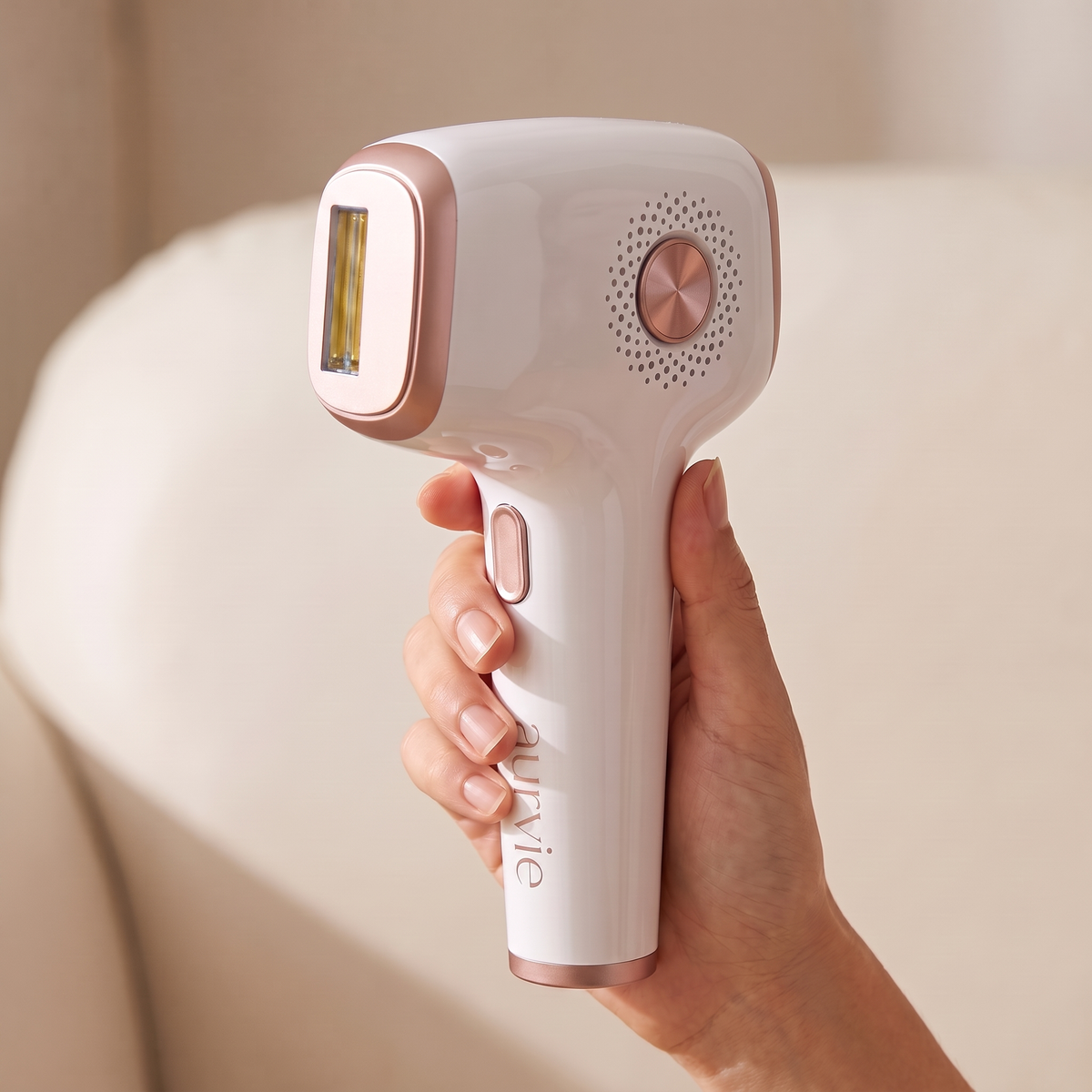 Hand holding the Aurvie Glow Pro device by its handle (ALT)